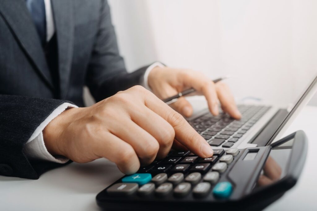 business-accounting-concept-business-man-using-calculator